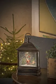 Met Water Gevulde Lantaarn Met Kerstman Bruin Van Konstsmide - Verspreid magie in de winterse duisternis met deze met water gevulde lantaarn met de Kerstman en kinderen!