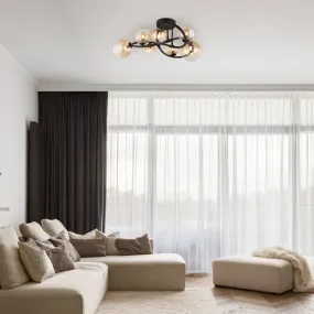 Tuberius Ø62 Amber plafondlamp Van Globo Lighting - Lampan &auml;r tillverkad av mattsvart metall och &auml;r smyckad med 7st glas i en&nbsp;mjuk b&auml;rnstensf&auml;rgad ton, vilket skapar en st&auml;mningsfull ljusspridning.