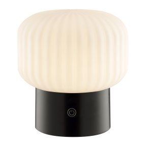 Sarastro 14cm Zwart Draagbare Van Brilliant - De gecanneleerde witte glazen kap zorgt voor een zachte gloed, terwijl de zwarte voet de touchdimmer herbergt en de RGB-functie bedient - alles in een discreet en elegant formaat.