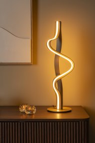 Lambada 60cm Champagne Van Lucide - Lambada is een elegante metalen tafellamp met een exclusieve champagnekleurige afwerking en een zachte, organische vorm die direct de aandacht trekt.