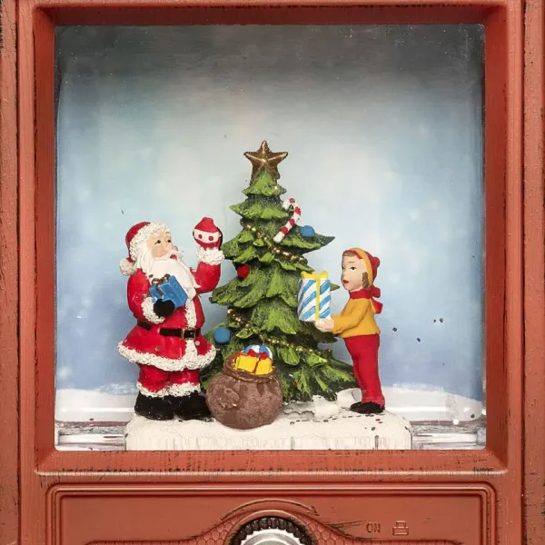 Met Water Gevulde Lantaarn In De Vorm Van Een Tv Bruin Van Konstsmide - Deze met water gevulde lantaarn in de vorm van een retro-tv toont een sfeervol tafereel met de Kerstman, een jongen en een versierde kerstboom.