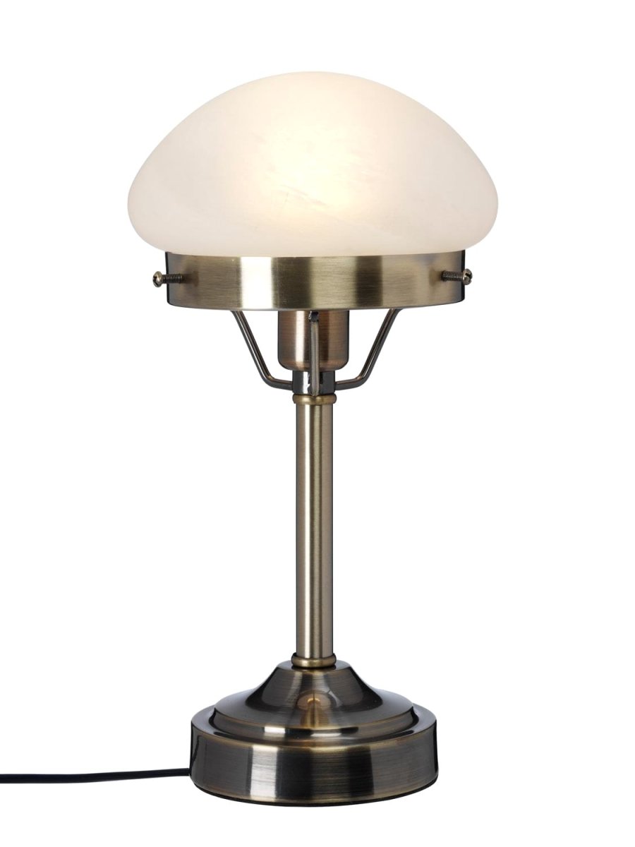 Mini Strindberg 30cm Antiek messing tafellamp Van Cottex - Dankzij de robuuste metalen constructie en het gematteerde glas verspreidt de lamp een zacht en aangenaam licht, perfect voor op het nachtkastje of als stijlvol interieurdetail in de woonkamer.