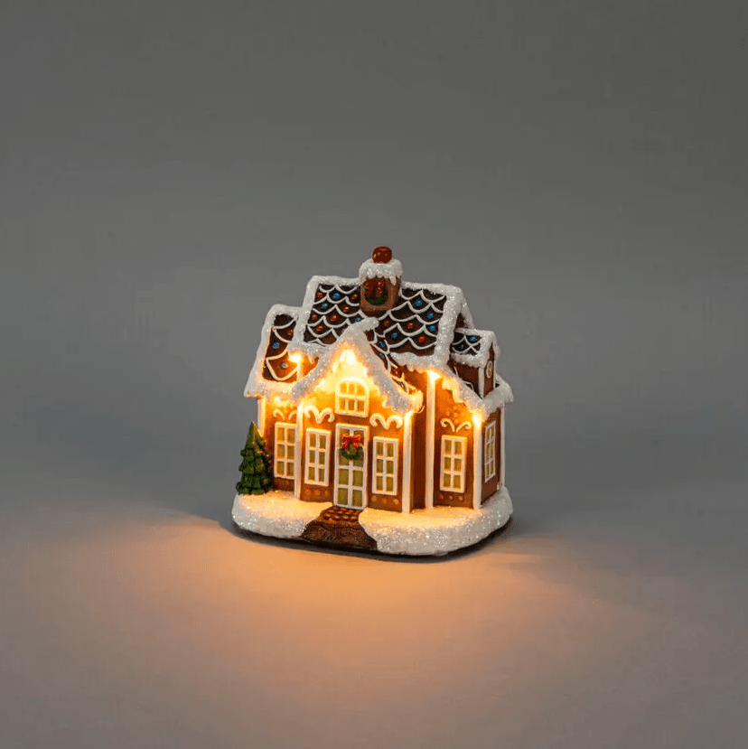 Peperkoekhuisje LED 17cm Bruin Van Konstsmide - Schattig peperkoekenhuisje met 9 LED-lampjes die de magie van Kerstmis verlichten met een warm wit licht.