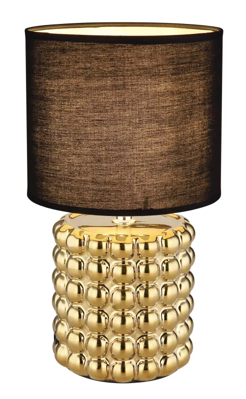 Valentino 33cm Goud tafellamp Van Globo Lighting - P&aring; en cylinderformad fot i guldf&auml;rgad keramik vilar en stilren, svart textilsk&auml;rm.