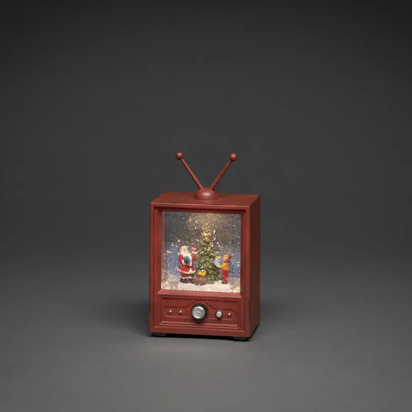 Met Water Gevulde Lantaarn In De Vorm Van Een Tv Bruin Van Konstsmide - Deze met water gevulde lantaarn in de vorm van een retro-tv toont een sfeervol tafereel met de Kerstman, een jongen en een versierde kerstboom.