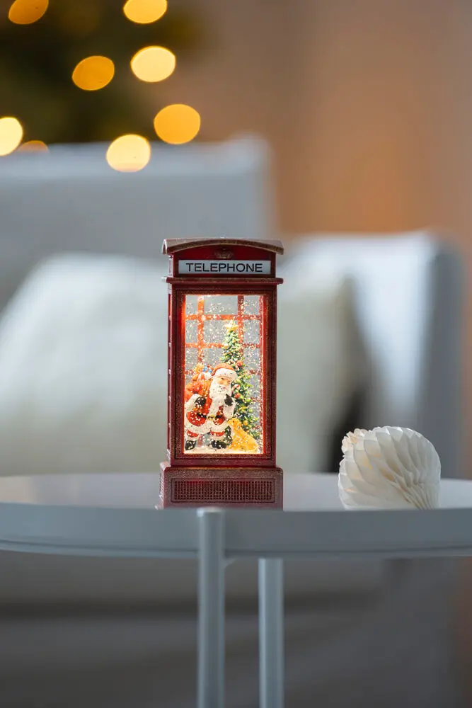 Met Water Gevulde Lantaarn Met telefooncel ROOD Van Konstsmide - Decoratieve mini-lantaarn gevuld met water in de vorm van een klassieke rode telefooncel met kerstmotief.