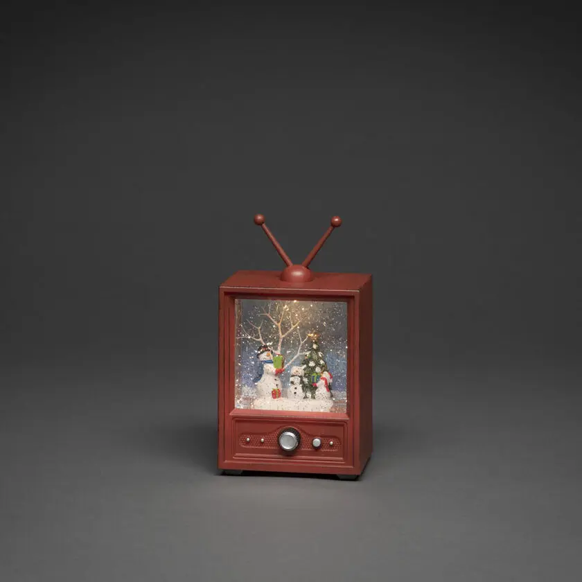 Met Water Gevulde Lantaarn In De Vorm Van Een Tv Bruin Van Konstsmide - Deze met water gevulde lantaarn heeft de vorm van een retro-tv en toont een winters tafereel met sneeuwmannen en een versierde kerstboom.