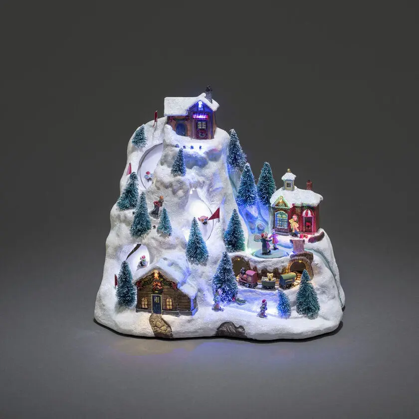 Mechanische Kerstdecoratie Met Berglandschap 28cm Veelkleurig Van Konstsmide - Het besneeuwde berglandschap licht op met prachtige LED-lampjes, bewegende details en speelt 8 klassieke kerstliedjes.