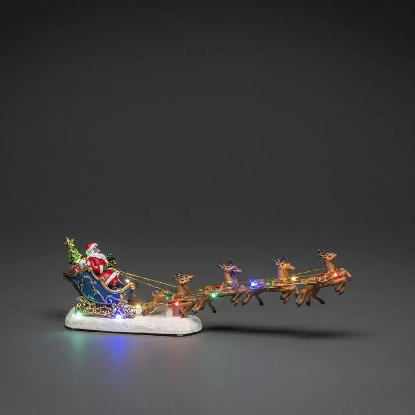 Kerstman Met Rendieren 14cm Veelkleurig Van Konstsmide - Elegante kerstversiering met de Kerstman in een slee en rendier, verlicht door kleurrijke LED-lampjes.