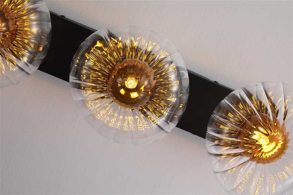 Sunbeam 52cm Transparant/zwart wandlamp Van Searchlight - De ronde, geribbelde kappen van transparant glas hebben een prachtige amberkleurige koepel aan de binnenkant die leven en structuur geeft, terwijl het licht zacht en aangenaam door de ruimte wordt verspreid.