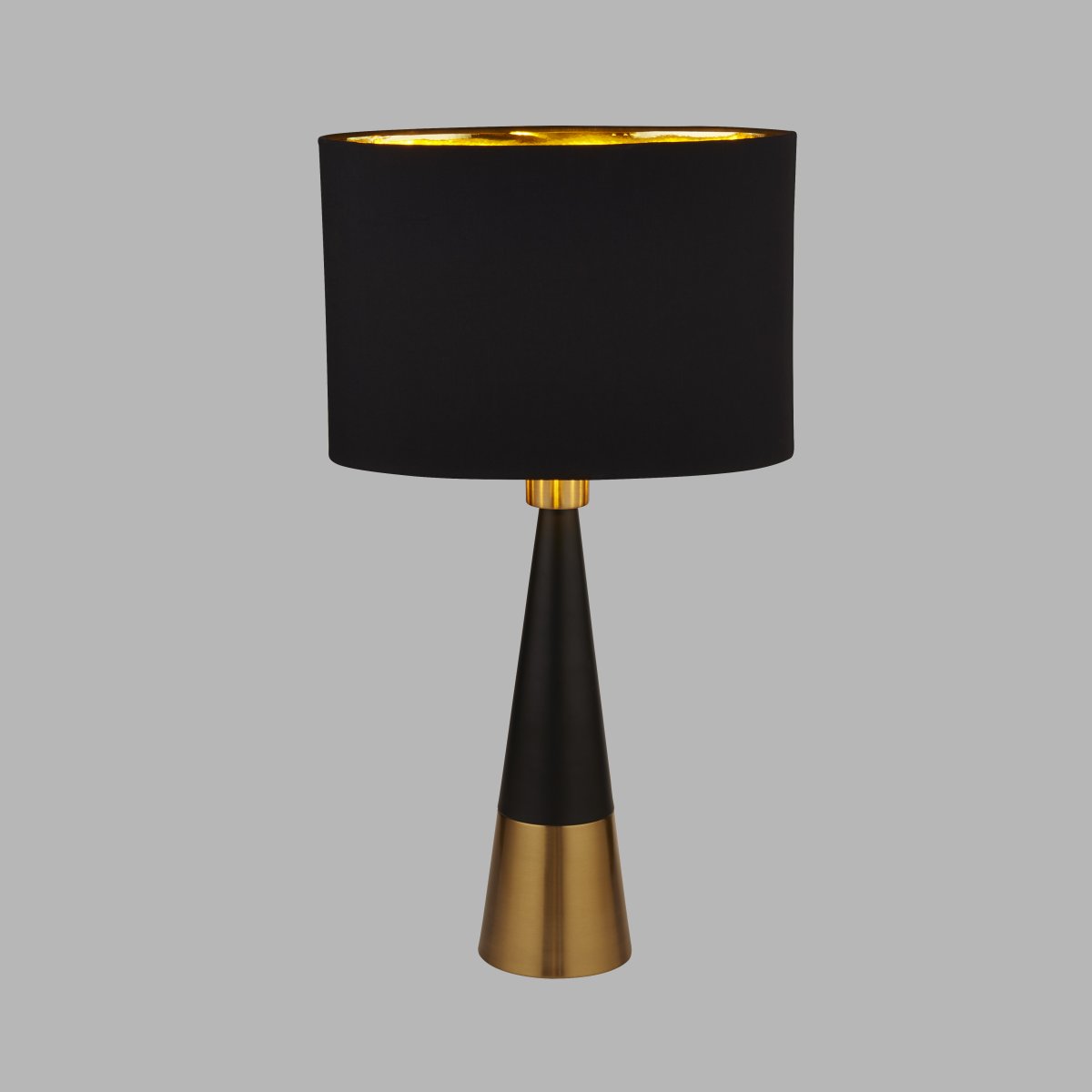 Chloe 40cm Matzwart tafellamp Van Searchlight - De ovale lampenkap met gouden binnenkant zorgt voor een warm en aangenaam licht, terwijl de slanke voet met contrasterende gouden voet een verfijnde toets toevoegt.