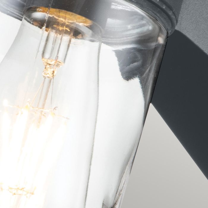 Portfino 20cm Grijs buitenlamp Van Elstead Lighting - Tillverkad av rostfritt st&aring;l i gr&aring; finish och glas, erbjuder den en robust och v&auml;dert&aring;lig konstruktion som &auml;r idealisk f&ouml;r fasader, entr&eacute;er och uteplatser.