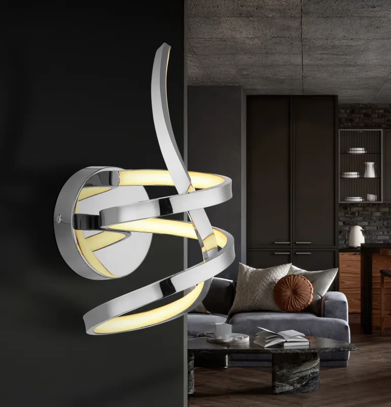 Iduna Ø35 Chroom wandlamp Van Globo Lighting - Iduna &auml;r en v&auml;gglampa som imponerar med sin unika design, d&auml;r den eleganta b&ouml;jda formen och den stilfulla knuten i mitten skapar en modern estetik.