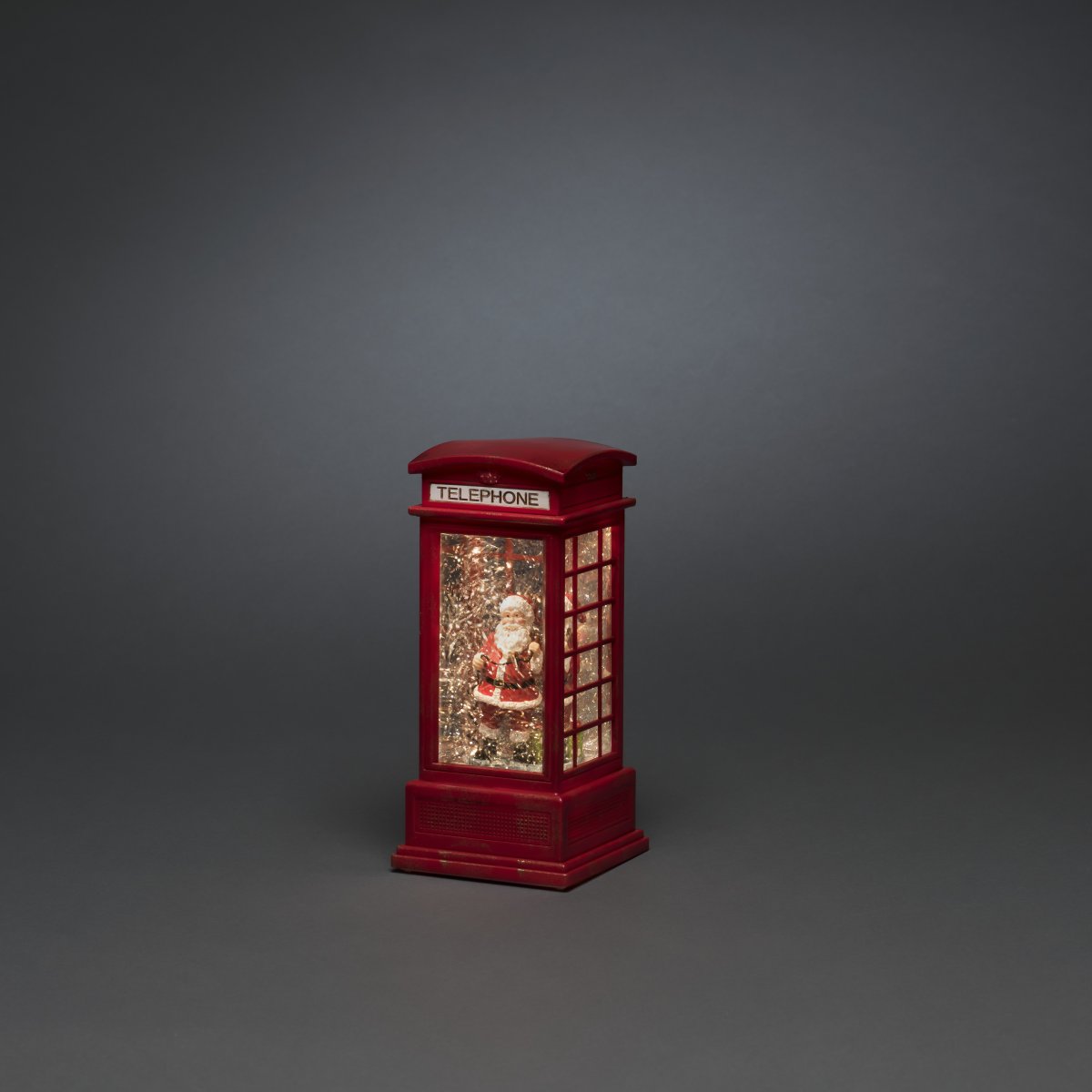 Watergevulde lantaarn Telefooncel ROOD Van Konstsmide - De met water gevulde lantaarn in de vorm van een telefooncel is een sfeervolle kerstdecoratie met een charmante kerstman in een klassieke rode telefooncel.