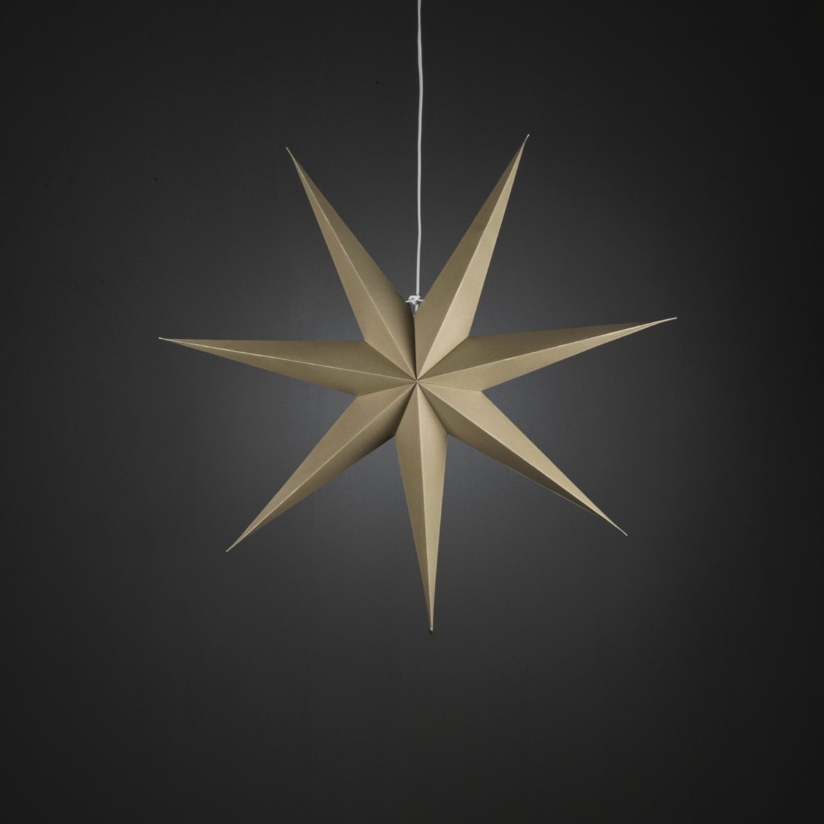 Papieren ster Ø78 Beige Van Konstsmide - Met zijn zeven punten en een royale diameter van 78 cm is het een prachtige blikvanger voor het raam of als hanglamp in de kamer.