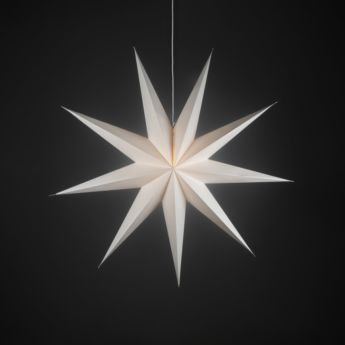 Papieren ster Ø115 Wit Van Konstsmide - Met zijn negen punten en een royale diameter van 115 cm is het een prachtige blikvanger voor het raam of als hanglamp in de kamer.