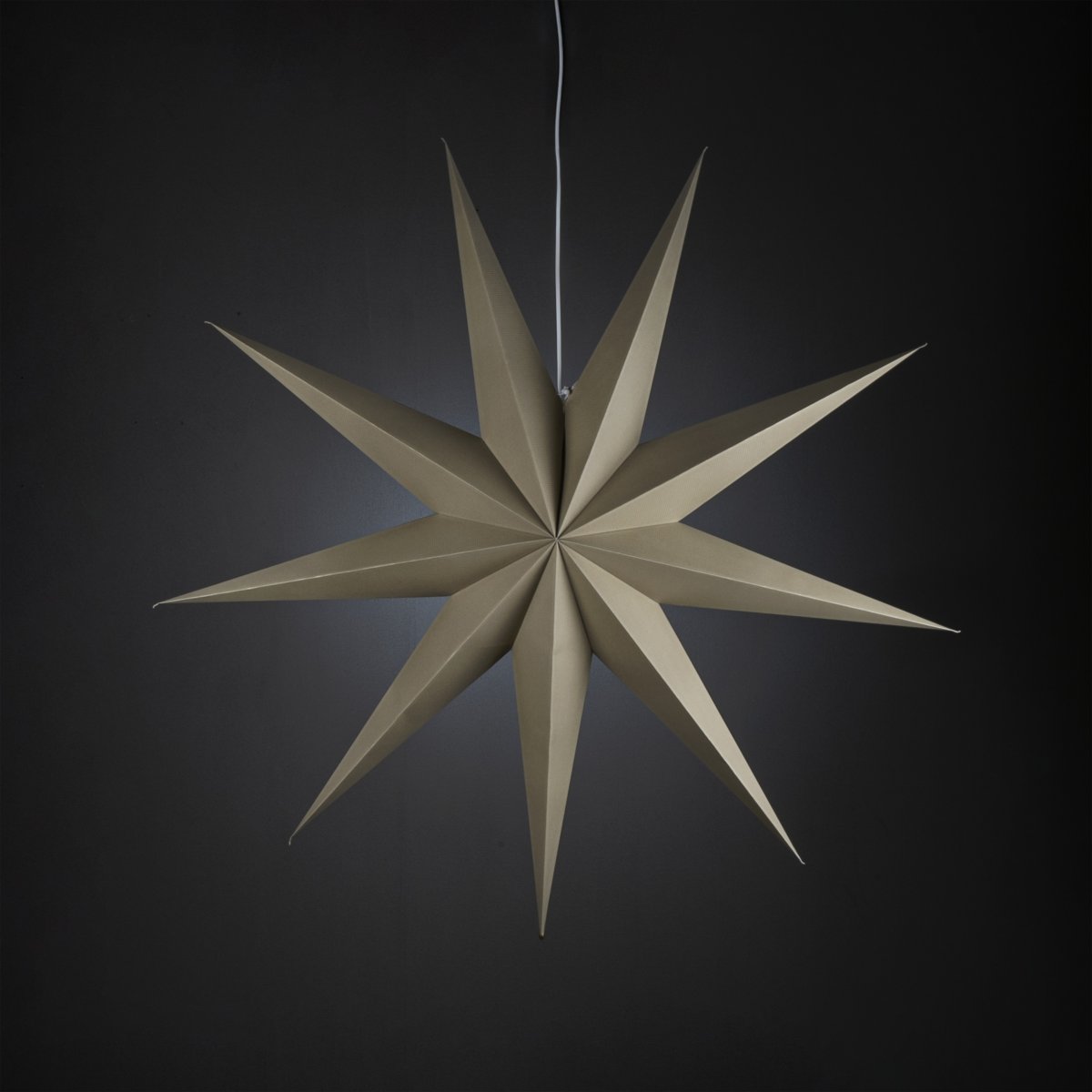 Papieren ster Ø115 Beige Van Konstsmide - Met zijn negen punten en een royale diameter van 115 cm is het een prachtige blikvanger voor het raam of als hanglamp in de kamer.