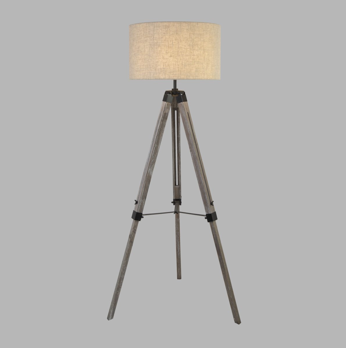 Easel Grijs vloerlamp Van Searchlight - Met een elegante houten driepootbasis; en een zachte linnen lampenkap, geeft het een warm en aangenaam licht dat een gezellige sfeer cre&euml;ert in elke kamer.