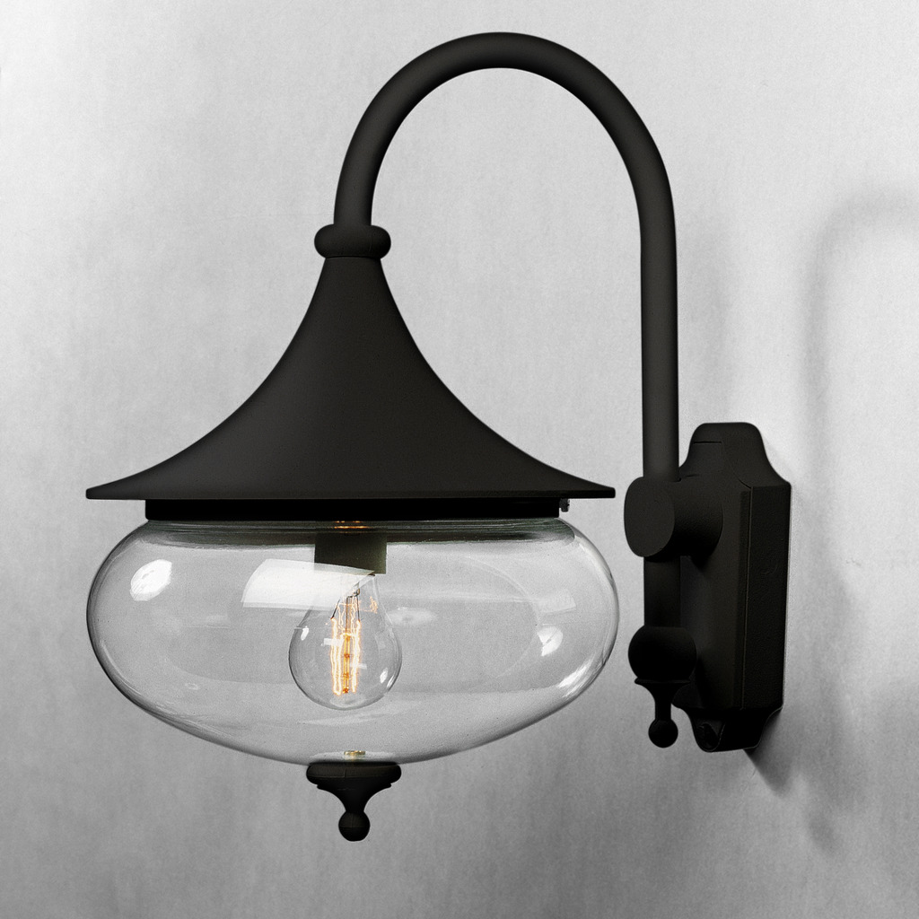Libra Zwart buitenlamp Van Konstsmide - De zachte vormen en de grote, heldere glazen kap van de lamp verspreiden een warm en aangenaam licht, wat een uitnodigende sfeer creëert in entrees of op patio's.
