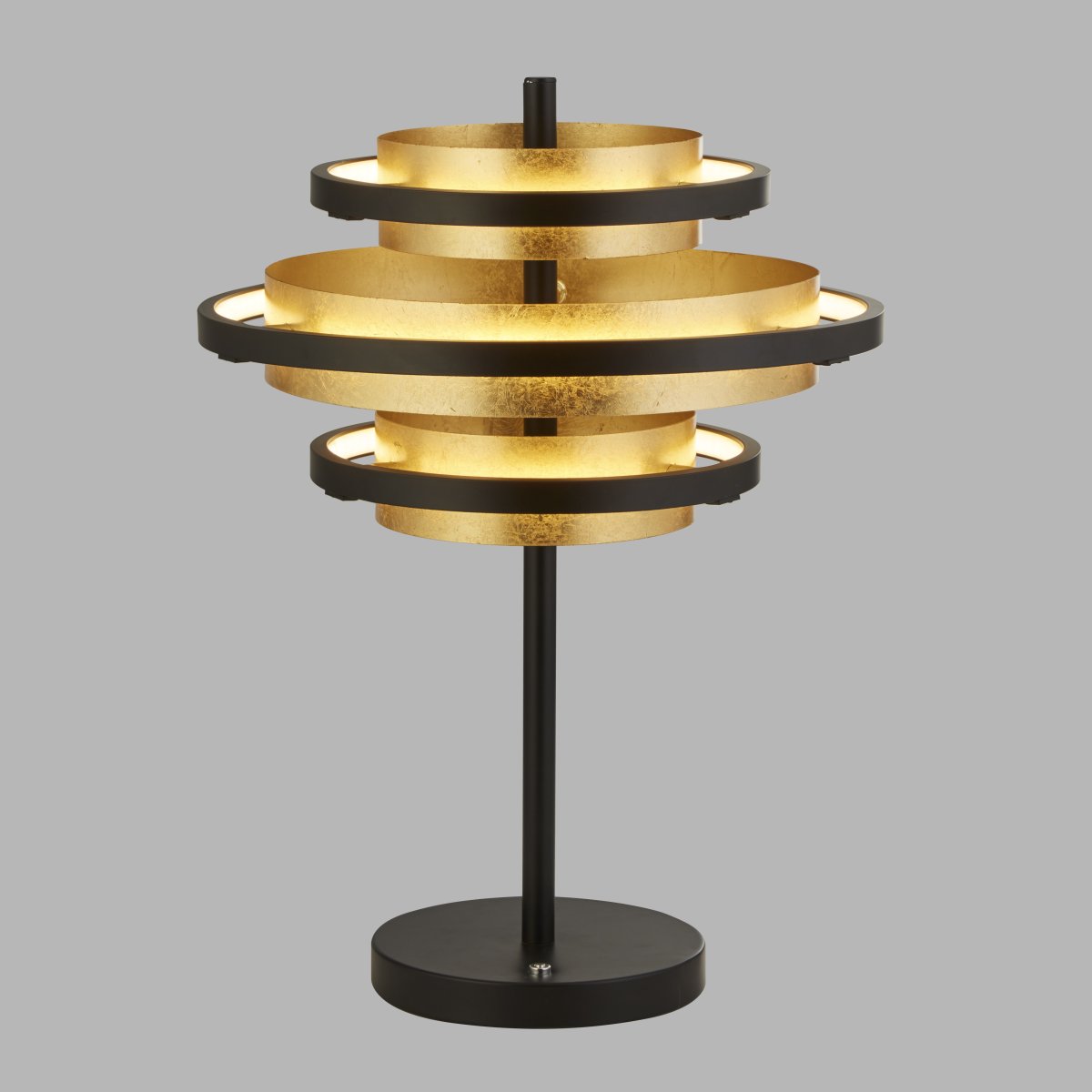 Hive 44cm Matzwart tafellamp Van Searchlight - De gelaagde ringen van de lamp verspreiden een zacht, warm licht dat in elke kamer een harmonieuze sfeer cre&euml;ert.