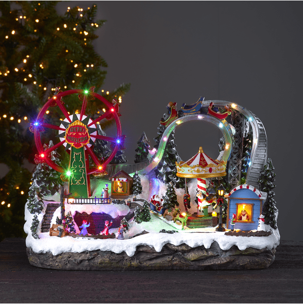 Largeville 36cm Veelkleurig Van Star Trading - Groot en gedetailleerd decoratiedorp in de vorm van een kermis met een ijsbaan, draaimolens en een bergdal.