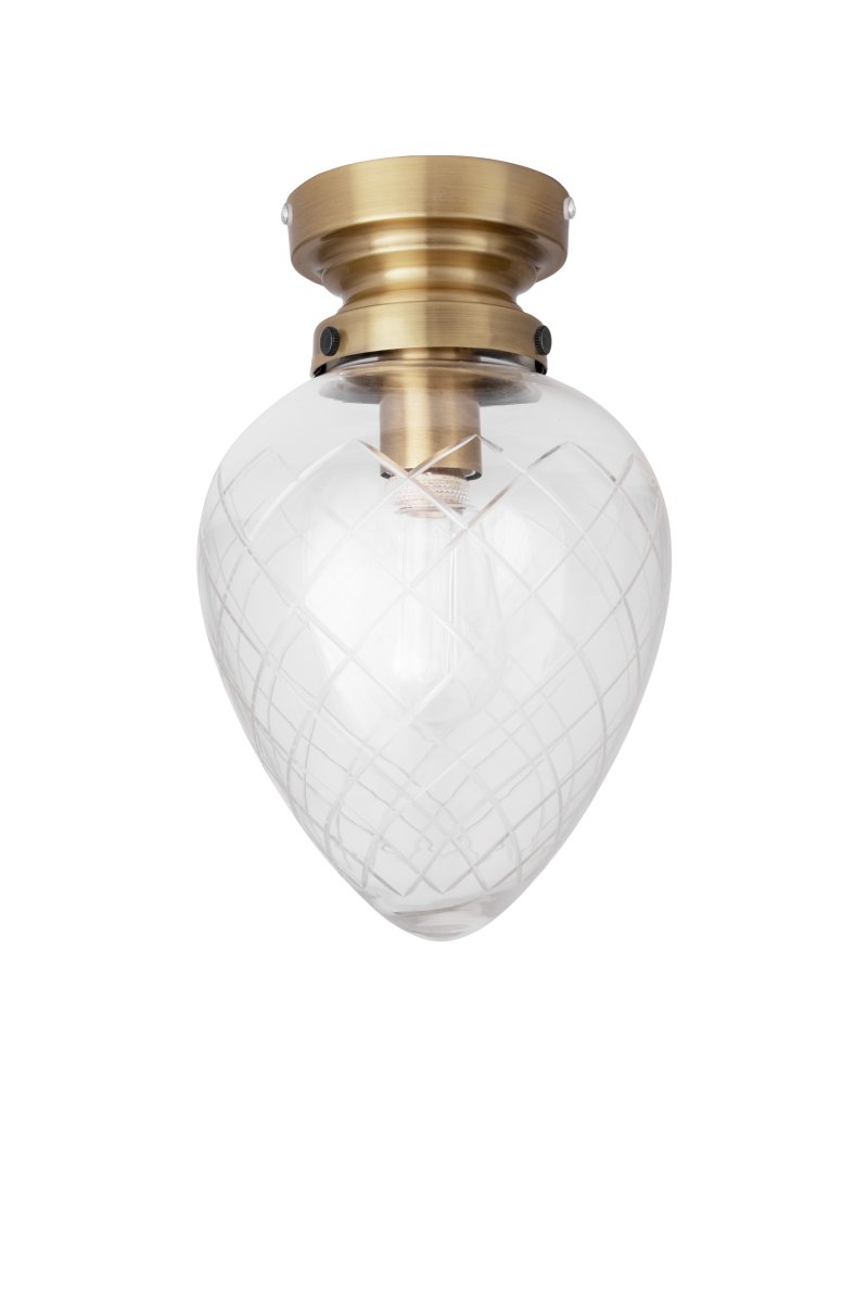 Juni Ø20 Antiek messing/transparant badkamerlamp Van Globen Lighting - Juni met zijn prachtige geslepen glas en metalen kap neemt je mee terug in de tijd naar het begin van de 20e eeuw.