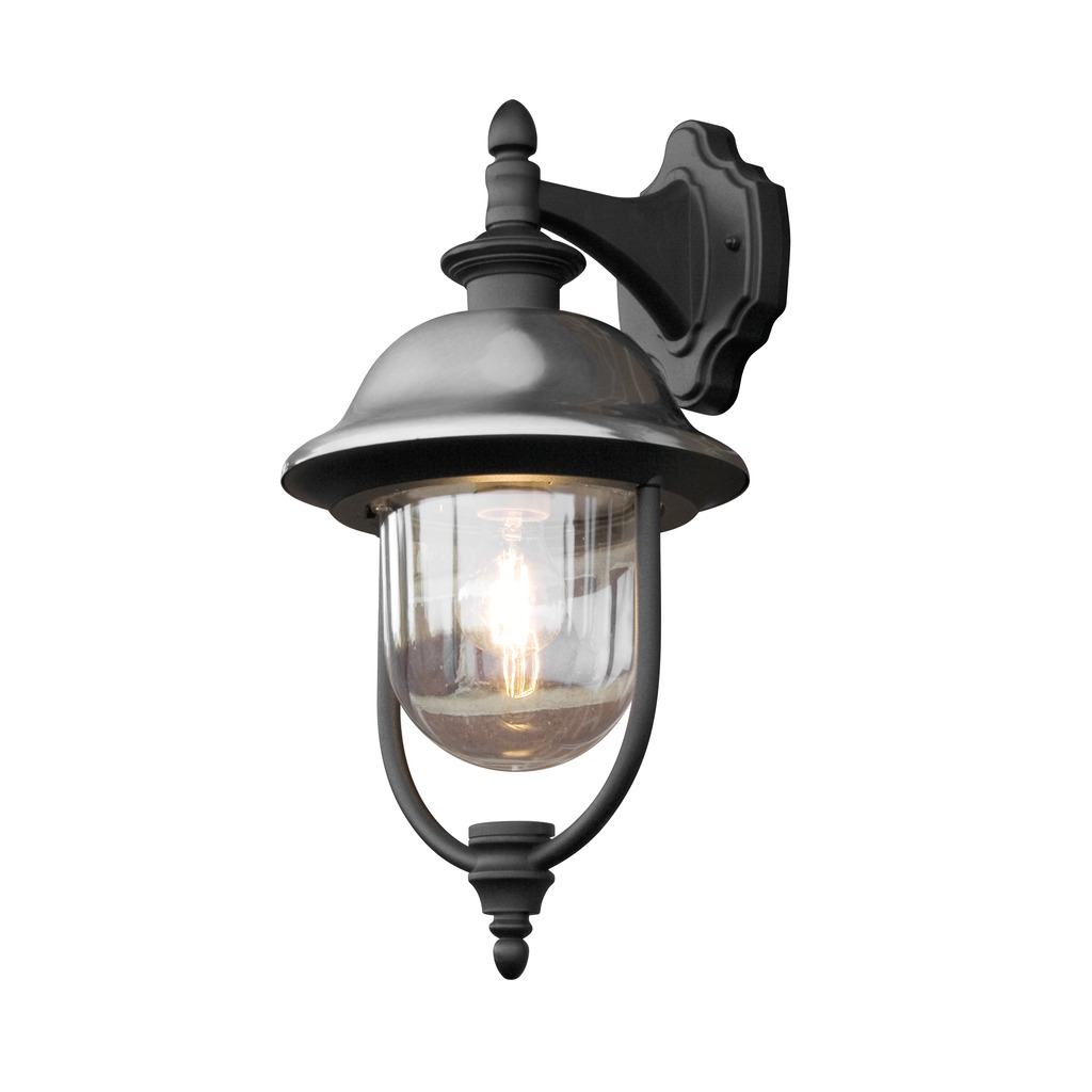 Parma Zwart buitenlamp Van Konstsmide - Dankzij de robuuste zwarte afwerking en de kap van helder glas verspreidt het een warm en uitnodigend licht, wat een uitnodigende sfeer creëert bij de entree of op het terras.