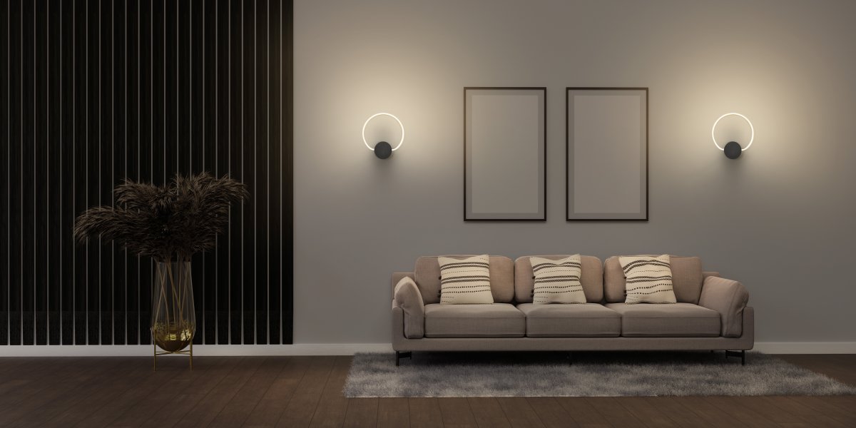 Aura Ø37 Zwart wandlamp Van Ledvance - Lampan har tv&aring; olika belysningspunkter med integrerad LED, en bakom v&auml;ggplattan och cirkeln.