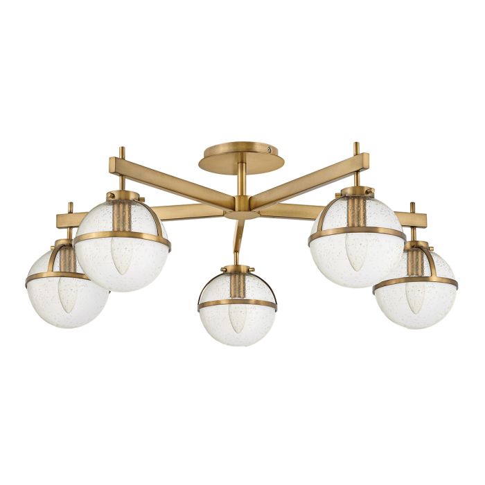 Hollis Ø80 Antiek messing/transparant badkamerlamp Van Elstead Lighting - Hollis is een decoratieve plafondlamp voor de badkamer met een uitgesproken vintage uitstraling, geïnspireerd op het midden van de 20e eeuw.
