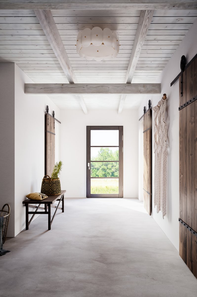 Omlott Ø53 Wit plafondlamp Van By Rydéns - Er is een prachtige plafondlamp omheen gewikkeld en met de messing details voegt het elegantie toe aan de kamer.