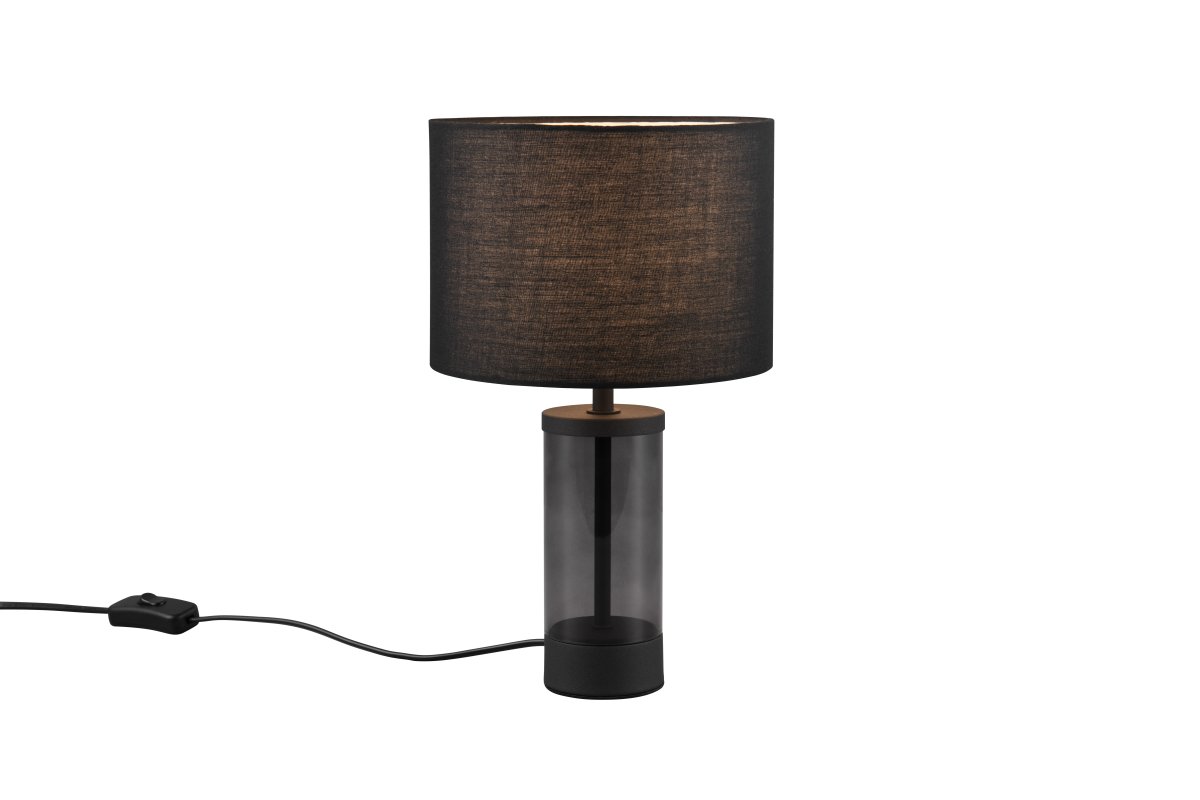 Grazia 34cm Zwart tafellamp Van Trio Lighting - De Grazia tafellamp combineert een elegante stoffen kap met een stijlvolle cilindrische voet van glas en metaal, wat een harmonieuze en verfijnde indruk geeft.
